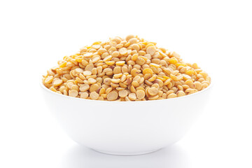  Close-up of Organic arhar dal (Cajanus cajan) or split yellow dal inside a ceramic white bowl. 