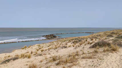 natural beach sand dunes with sea water on Soulac-sur-Mer in france