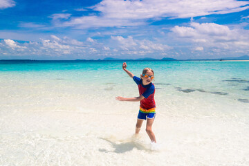 Kids playing on beach. Children play at sea.