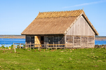 Lakeshore with a wooden barn