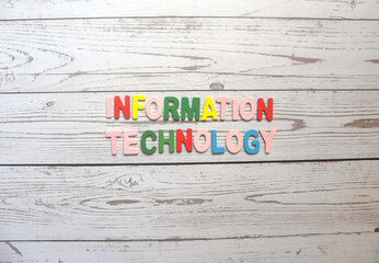 Words Information Technology on wood background