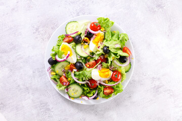 vegetable salad with egg, cucumber and tomato