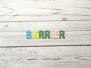 Word Barrier on wood background