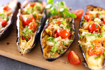 baked aubergine on wooden board