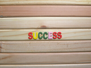 Word Success on wood background