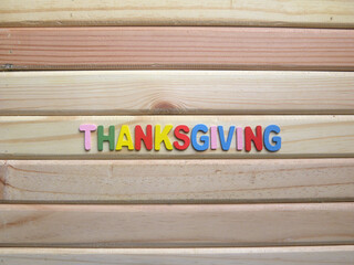 Word Thanksgiving on wood background