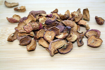 Apples dried on the stove. White background.