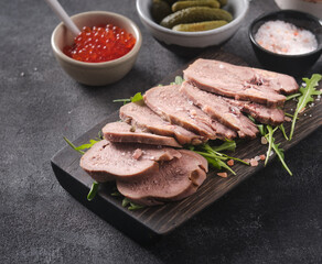 Boiled beef tongue, a delicacy. Slices of cold beef tongue.