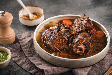 Dish of beef, bacon and pickle roulades in gravy seasoned with vegetables for a traditional...