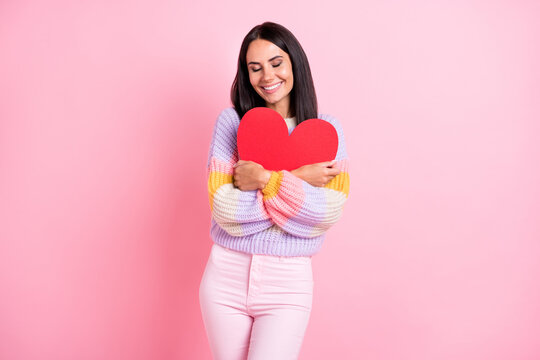 Photo of young cheerful girl happy positive smile hug big red paper heart love valentine day isolated over pastel color background