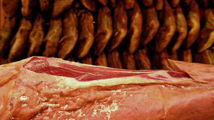 Leg of iberian Ham in the Central Market of Valencia. Fresh dry-cured meat.