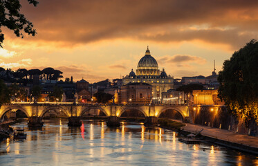 Fototapeta na wymiar Rome Italy. San Pietro basilica in the Vatican, ponte Sant Angelo and Tiber river, sky at sunset
