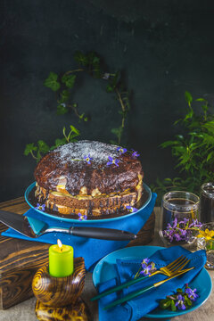 Delicious homemade cake served on wooden table. Chocolate cake food photography recipe idea