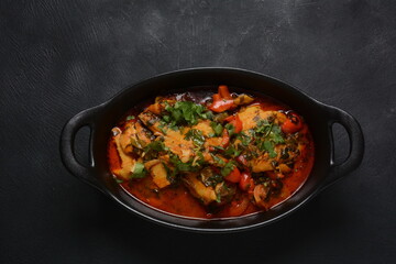 Moroccan fish  with chermoula, red peppers and preserved lemon. Spicy traditional  Moroccan food