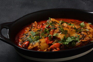 Moroccan fish  with chermoula, red peppers and preserved lemon. Spicy traditional  Moroccan food