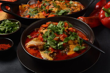 Moroccan fish  with chermoula, red peppers and preserved lemon. Spicy traditional  Moroccan food
