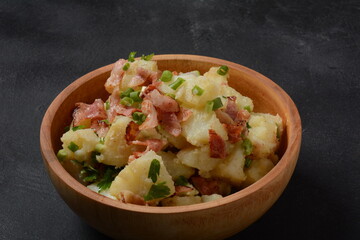 Kartoffelsalat - traditional German potato salad. Potato salad with bacon