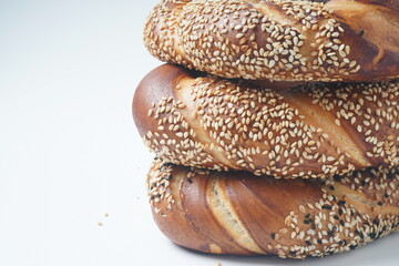 Fresh bread bagel with poppy and  sesame coating. Jewish or  German  form of sweet-filled pastry