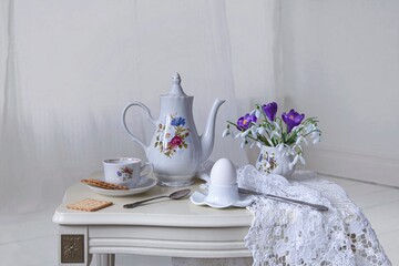Still life with spring breakfast on a white table