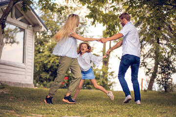 Family dancing in backyard.