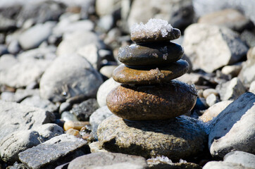 balance of stones, cairn of stones on the waterfront
