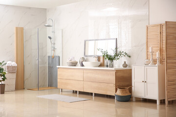 Modern bathroom interior with stylish mirror and vessel sink