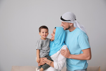 Happy Muslim family spending time together at home
