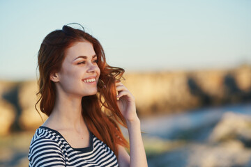 happy woman in striped t-shirt red hair model smile