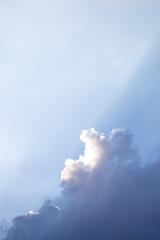 Beautiful white clouds and clear blue sky There is light shining through the clouds that are about to rain. Sky image for background design The blue color makes you feel fresh and bright.