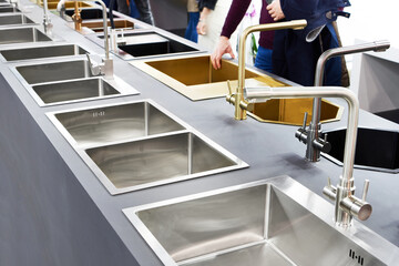 Modern kitchen water faucets and kitchen sinks in store
