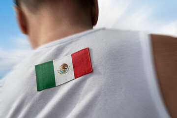 The national flag of Mexico on the athlete's back