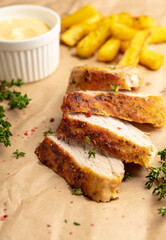 Grilled pork meat sliced on the kitchen table. Selective focus. Shallow depth of field.