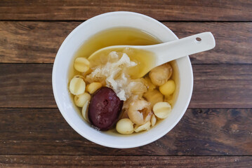 Chinese festive sweet delicacy / Chinese New Year Lotus Seed Longan Snow Fungus Dessert Soup with Lily Bulb & Red Dates / Usually served warm after dinner meal and it's good for health