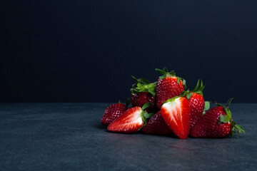 strawberry on black background - obrazy, fototapety, plakaty