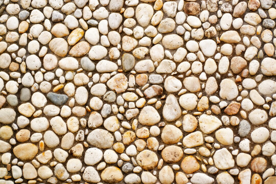 sea pebbles in wall ornament , banner texture in abstract background