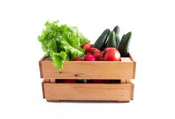 Wooden crate full of fresh vegetables from the garden