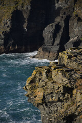 Lichen covered cliff at Tintagel Cornwall