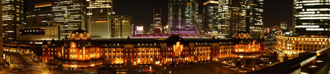 Fototapeta na wymiar Tokyo Station and skyscraper at night in Tokyo, Japan. Panoramic view - 東京駅 夜景 日本 パノラマ