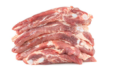 Sliced raw pork ribs are isolated on a white background.