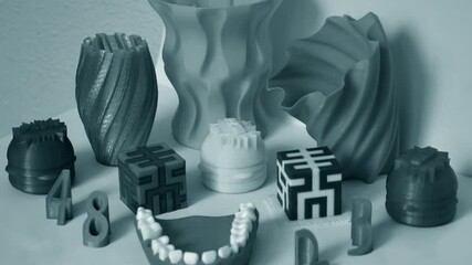 Models printed by 3d printer. Objects printed on 3d printer on table