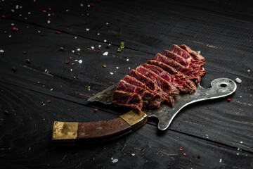 Barbecue Rib Eye Steak rump steak Dry Aged Wagyu over meat butcher knife. banner, menu recipe place...