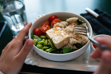 Healthy breakfast bowl with porridge and fresh vegetable salad