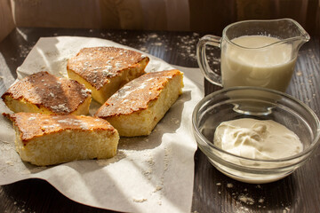 basque cheesecake with milk and sour cream on the table