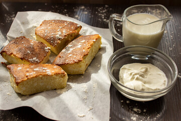 basque cheesecake with milk and sour cream on the table