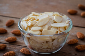 Almond slices in glass bowl.