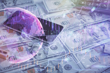 Naklejka premium Double exposure of forex graph drawing over us dollars bill background. Concept of financial markets.