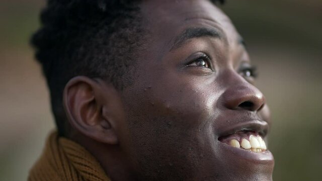 Smiling happy black african man portrait face close-up