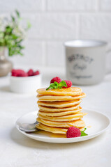 Delicious fluffy golden pancakes. Great idea for a sunny summer breakfast. A great treat for children.