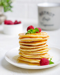 Delicious fluffy golden pancakes. Great idea for a sunny summer breakfast. A great treat for children.