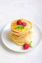 Delicious fluffy golden pancakes. Great idea for a sunny summer breakfast. A great treat for children.